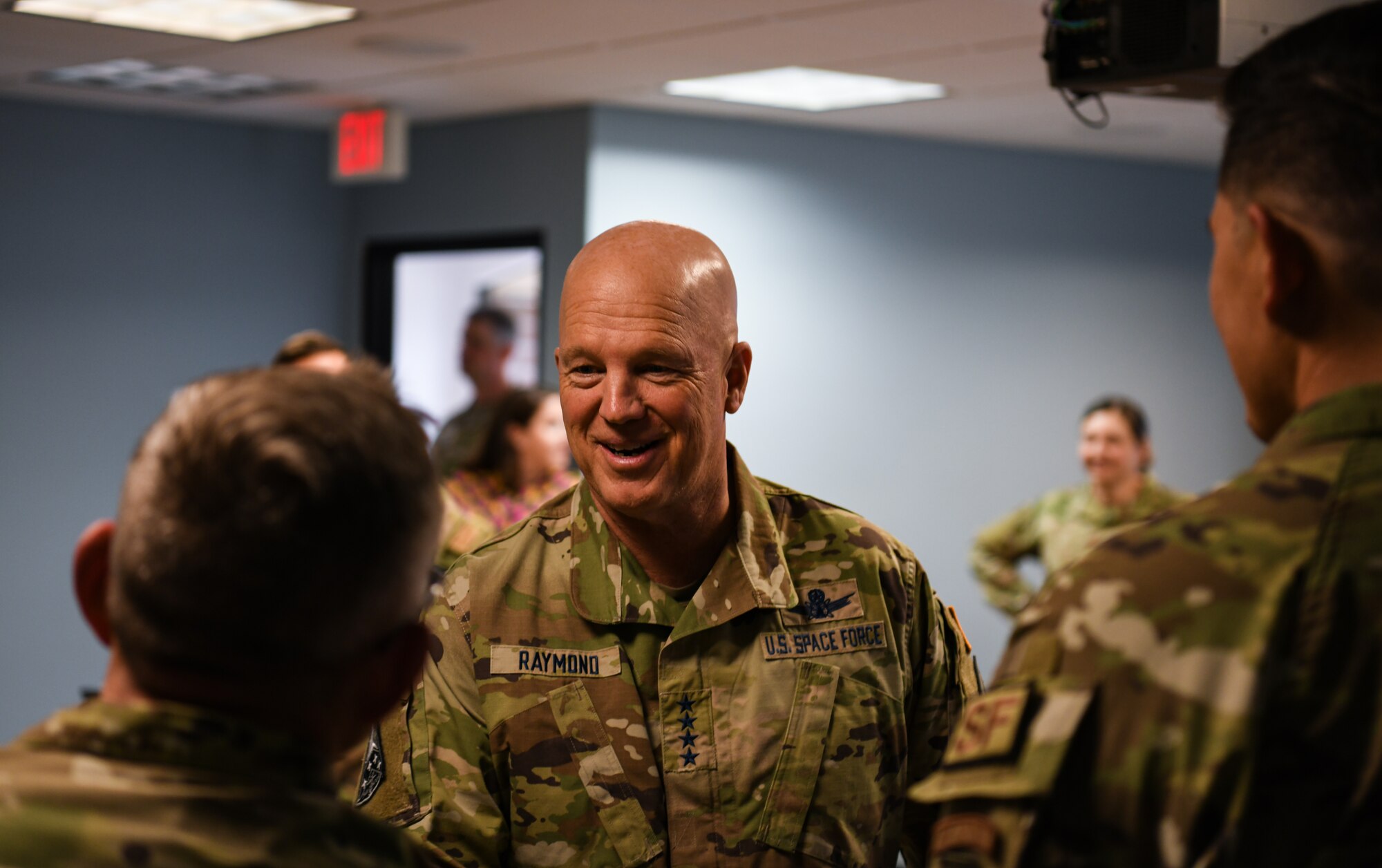 U.S. Space Force Gen. John W. “Jay” Raymond greets an airman during his visit to the Hawk’s Cove at Vandenberg Space Force Base, Calif., Oct. 11, 2022. Raymond visited the Hawk’s Cove for the first time since it was created, where it is first to combine all the military and civilian helping agencies, such as Equal Opportunity and the Sexual Assault Response coordinator’s office, into one centralized location. (U.S. Space Force photo by Airman 1st Class Ryan Quijas)