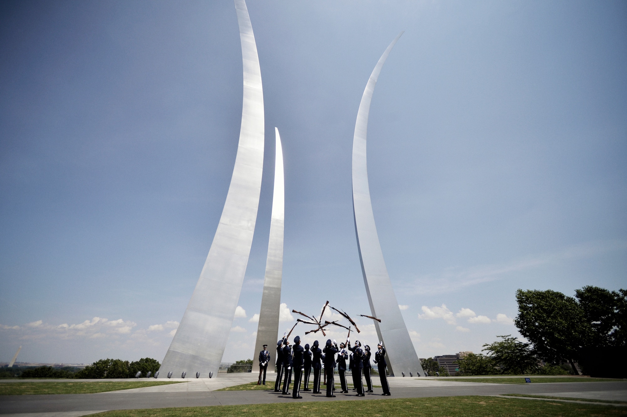 Honor Guard members throw rifles in air at Air Force Memorial