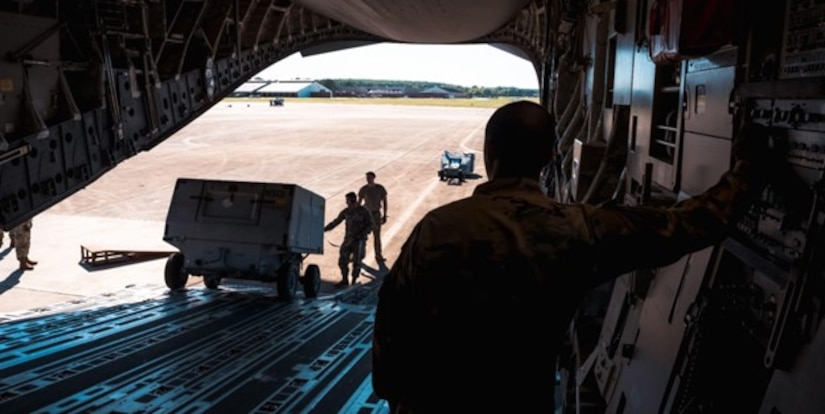 U.S. Air Force Airmen assigned to the 6th Airlift Squadron and 1st Fighter Wing off-load Aerospace Ground Equipment on Joint Base Langley-Eustis, V.A., Sept. 27, 2022.