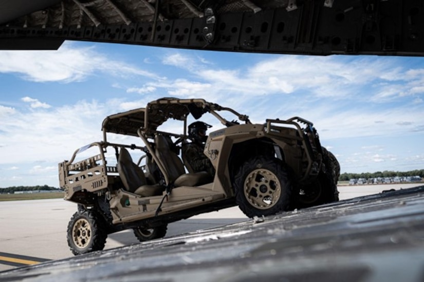 An Airman assigned to the 621st Contingency Response Wing drives a Polaris MRZR Diesel tactical off-road vehicle onto a C-17 Globemaster on Joint Base McGuire-Dix-Lakehurst, N.J., Sept. 29, 2022.