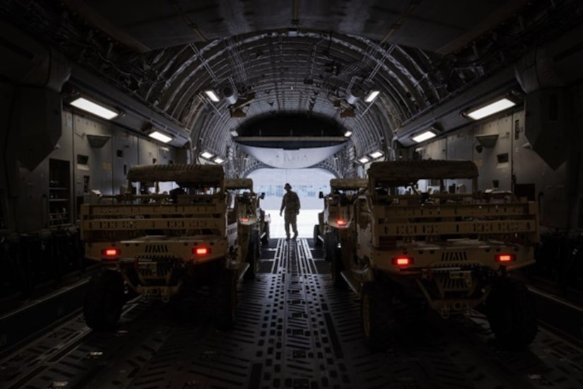 Vehicles sit in cargo bay of C-17 Globemaster