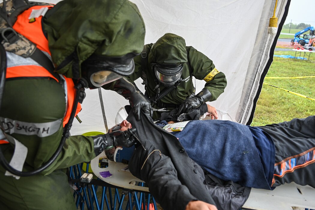 New York National Guardsman of the 152nd Engineer Battalion practice decontaminating casualties as part of a Homeland Response Force validation exercise at Fort Indiantown Gap, Pa., on September 11, 2022.