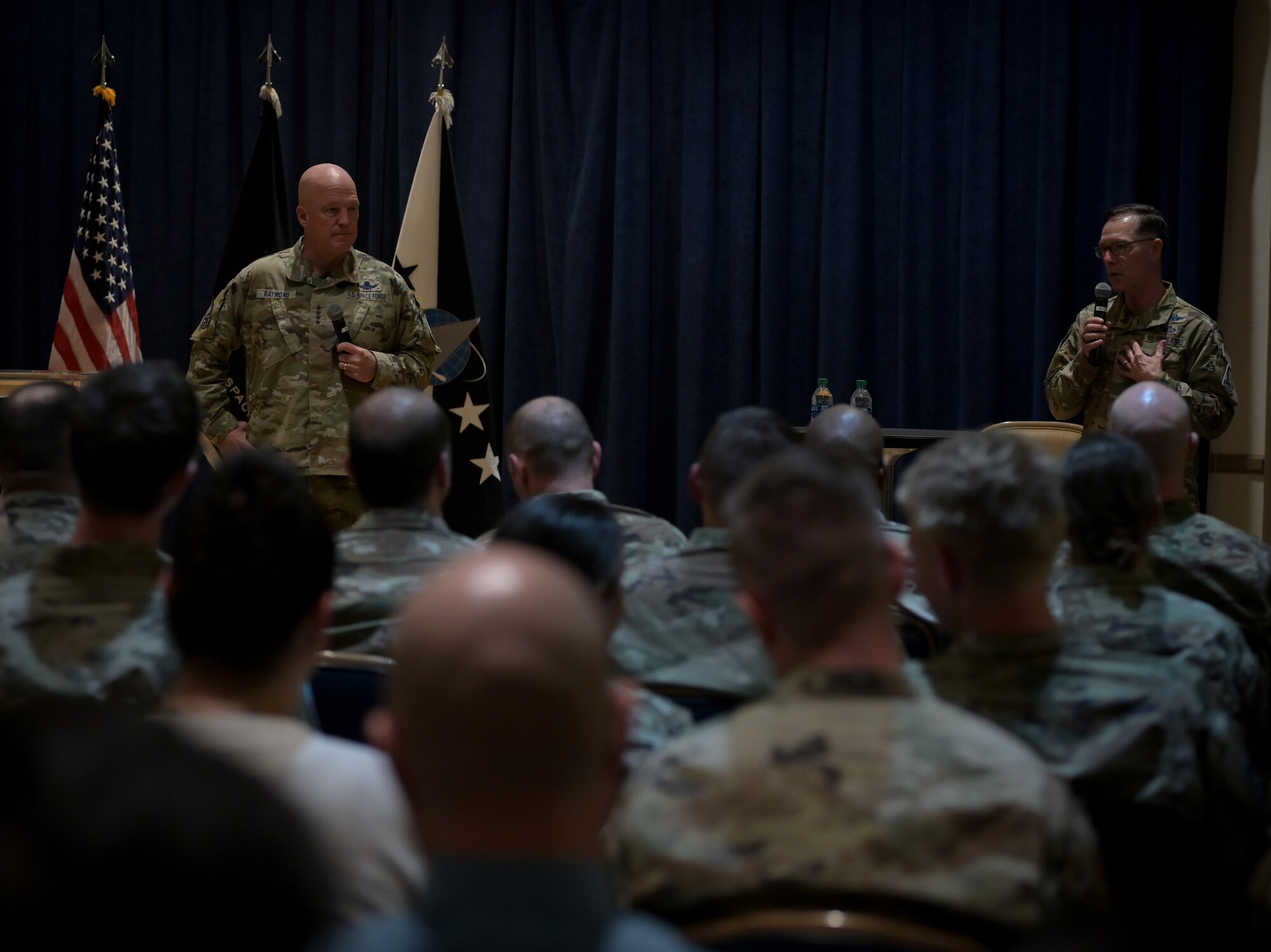 U.S. Space Force Gen. John "Jay" Raymond, Chief of Space Operations, and U.S. Space Force Chief Master Sgt. Roger Towberman, Chief Master Sgt. of the Space Force, discusses the importance of space and the cruciality of the Guardians that make assured access to space possible on Oct. 11, 2022, at Vandenberg Space Force Base, Calif. Gen. Raymond spoke about these matters during an all-call located on base. (U.S. Space Force photo by Airman First Class Rocio Romo)