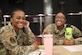 U.S. Air Force Senior Airman Paige Cesar (left) 83d Network Operations Squadron directory services operator and Senior Airman Kamisha Cannon, 83d Network Operations Squadron commander support staff technician smile for a photo during the Professional Enhancement Seminar at Joint Base Langley-Eustis, Virginia, Sept. 22, 2022.