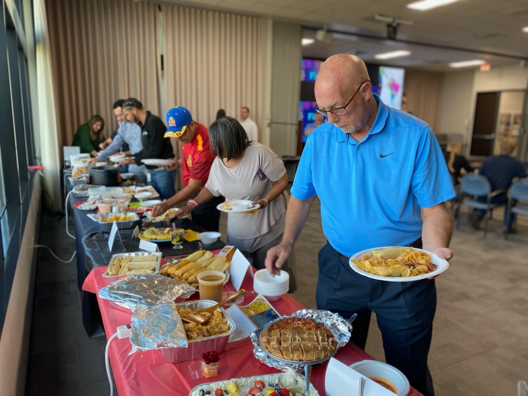 Employees from the U.S. Army Corps of Engineers (USACE) Galveston District enjoy a sampling of several traditional from Latin America during a special Hispanic Heritage Month presentation, October 12.