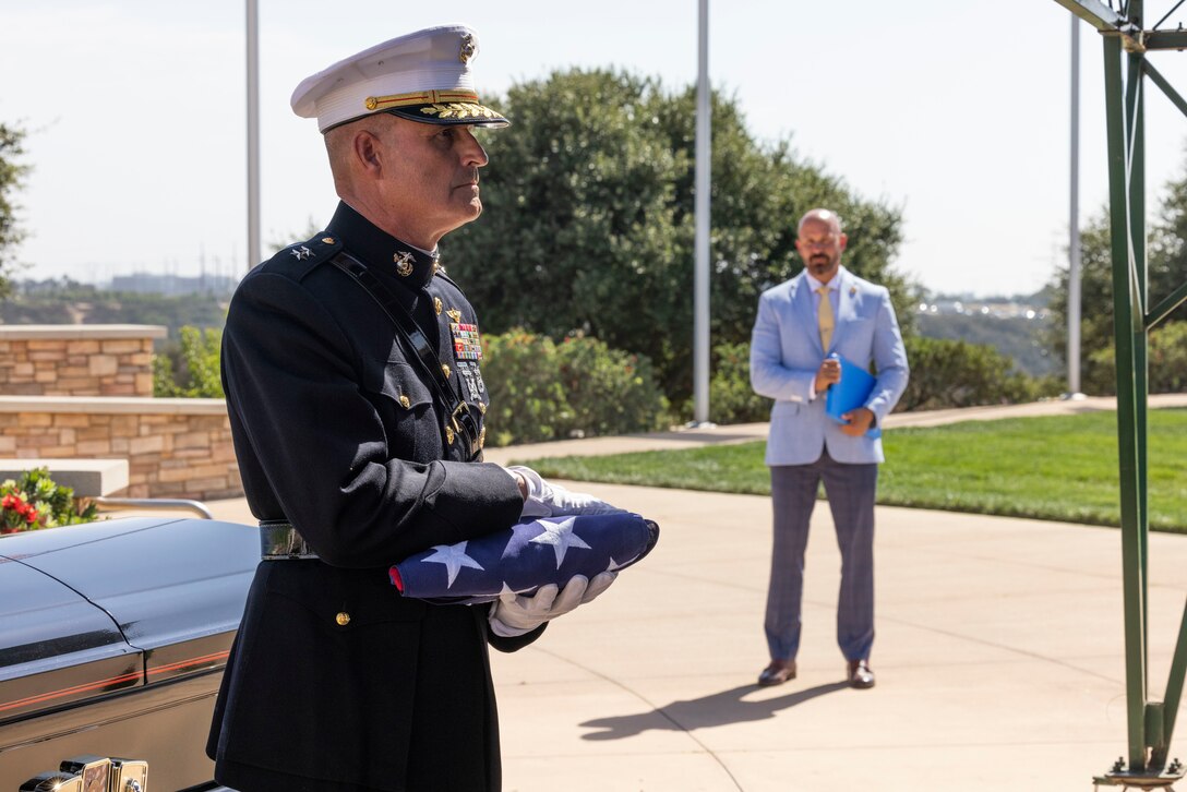 U.S. Marine Corps Maj. Gen. Bradford J. Gering, commanding general of 3rd Marine Aircraft Wing, holds the American flag during the funeral of U.S. Marine Corps Gen. Joseph P. Hoar (retired) at Miramar National Cemetery, San Diego, California, Oct. 7, 2022. Gen. Hoar served honorably for 37 years and held many distinguished positions including Commanding Officer, 1st Marine Regiment; Commanding General, Eastern Recruiting Region; and Commander, United States Central Command. (U.S. Marine Corps photo by Sgt. Rachaelanne Woodward)