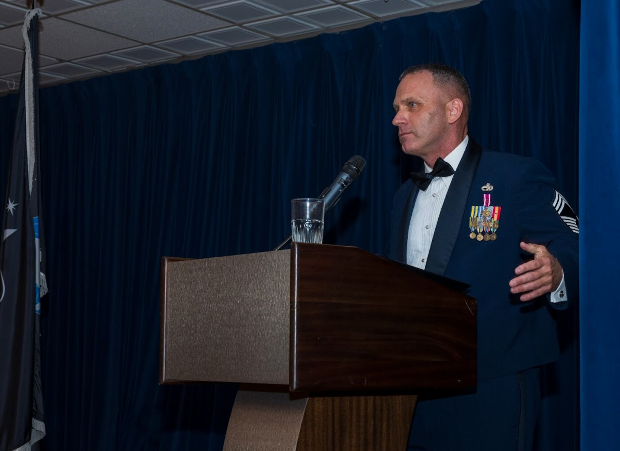 CMSgt FIsher giving a speech at the ALS graduation
