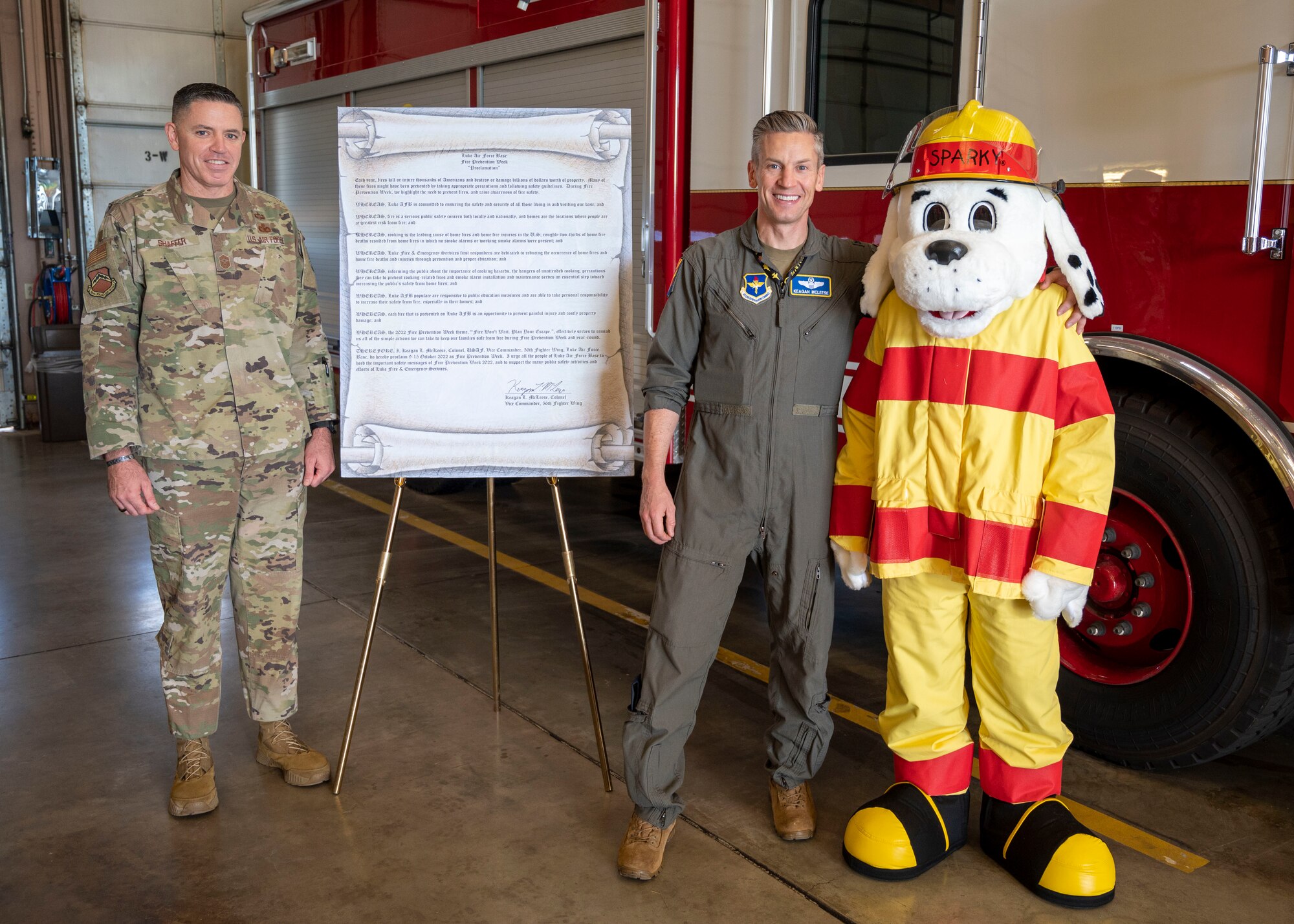 (From left to right) U.S. Air Force CMSgt. Jason Shaffer, 56th Fighter Wing command chief, Col. Keagan McLeese, 56th FW vice commander and 56th Civil Engineer Squadron “Sparky” kick-off this year’s Fire Prevention Week Oct. 7, 2022, at Luke Air Force Base, Arizona.