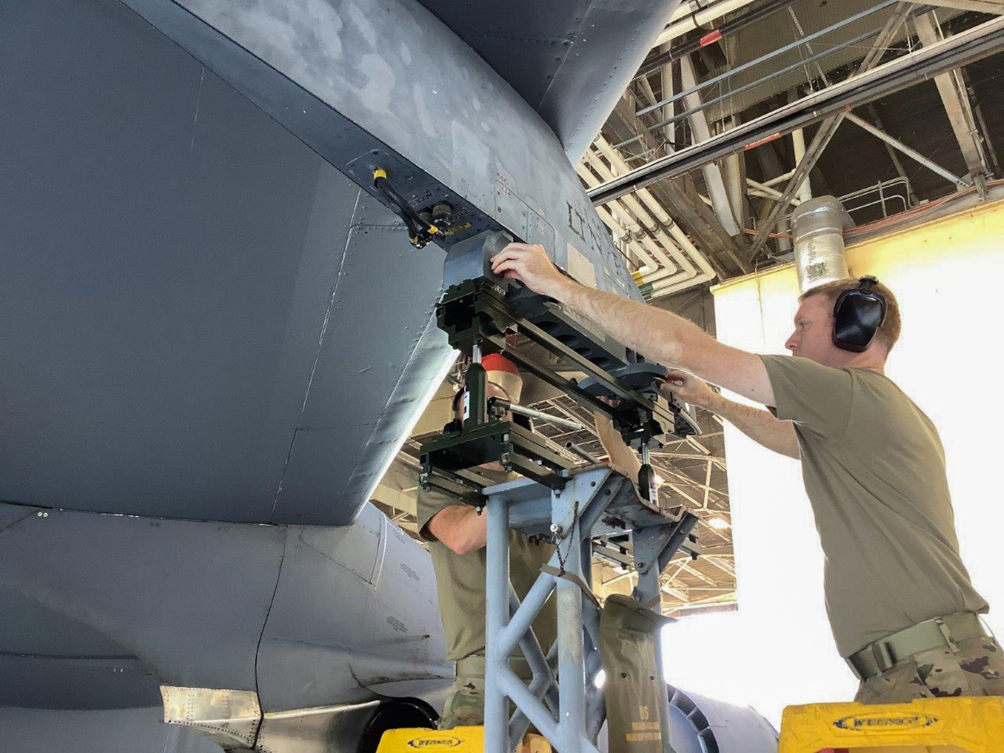 Airmen work on a B-52