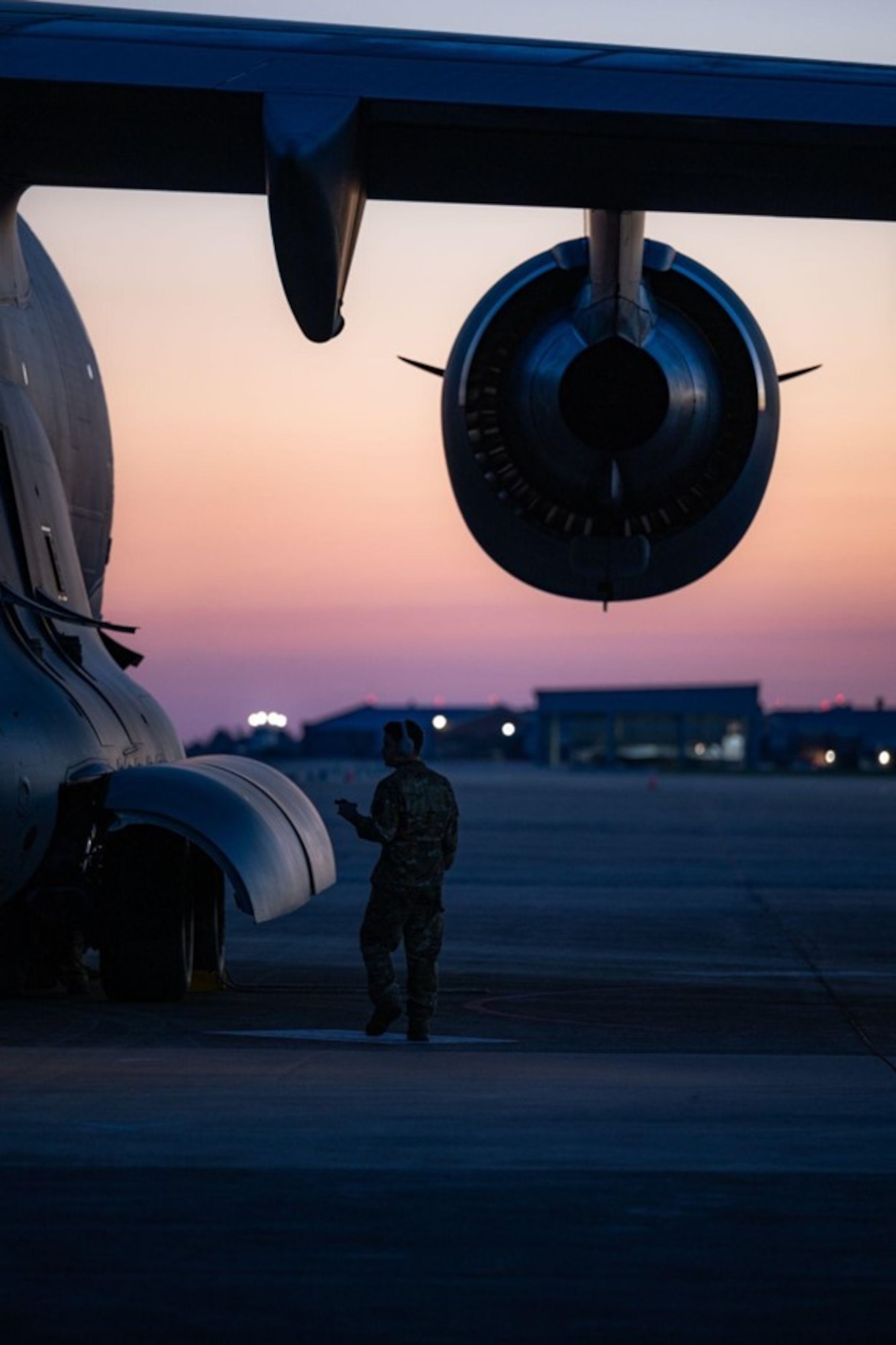 A flying crew chief assigned to the 305th Aircraft Maintenance Squadron inspects the exterior of a C-17 Globemaster on Joint Base Langley-Eustis, V.A., Sept. 27, 2022.