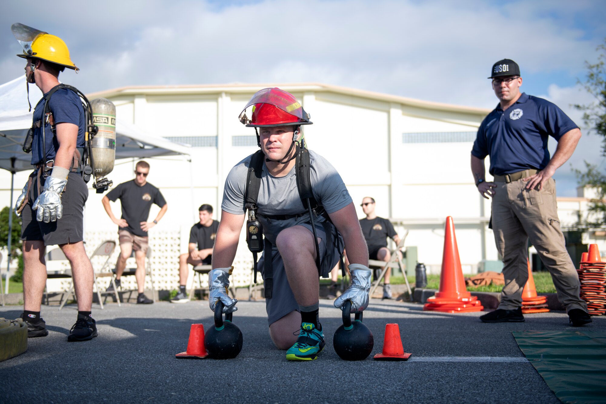 Senior Airman Armand Vidovic, 18th Civil Engineer Squadron explosive ordnance disposal technician, begins the fire muster challenge kettlebell run during National Fire Prevention Week at Kadena Air Base, Japan, Oct. 6, 2022. The competitive event was part of a week-long effort to promote fire safety and prevention to the Team Kadena community. (U.S. Air Force photo by Senior Airman Jessi Roth)