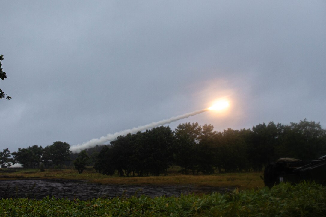 Members of the Northern Army, Japan Self-Defense Force, fire rockets from a Multiple Launch Rocket System alongside U.S. Marine Corps High Mobility Artillery Rocket Systems with 3d Battalion, 12th Marines during exercise Resolute Dragon 22 at Yausubetsu Maneuver Area, Hokkaido, Japan, Oct. 10, 2022. Resolute Dragon 22 is an annual bilateral exercise designed to strengthen the defensive capabilities of the U.S.-Japan Alliance by exercising integrated command and control, targeting, combined arms, and maneuver across multiple domains. (U.S. Marine Corps photo by Cpl. Diana Jimenez)