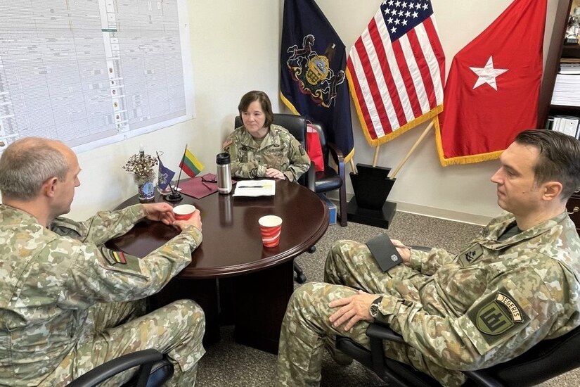 (Left to right) Brig. Gen. Arturas Radvilas, Lithuanian Land Forces commander, Brig. Gen. Laura McHugh, deputy adjutant general-Army, Pennsylvania National Guard, and Brig. Gen. Modestas Petrauskas, Lithuanian defense attaché to the United States and Canada, talk at the Pennsylvania National Guard Joint Force Headquarters at Fort Indiantown Gap, Pa., on Oct. 9, 2022. Radvilas, Petrauskas and Command Sgt. Maj. Darius Masiulis, Lithuanian Land Forces command sergeant major, visited Fort Indiantown Gap and attended the 28th Infantry Division departure ceremony in Harrisburg on Oct. 9.