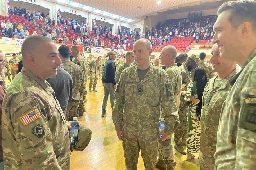 Maj. Gen. Mark McCormack, left, commanding general of the 28th Infantry Division, talks with Brig. Gen. Arturas Radvilas, Lithuanian Land Forces commander, Command Sgt. Maj. Darius Masiulis, Lithuanian Land Forces command sergeant major, and Brig. Gen. Modestas Petrauskas, Lithuanian defense attaché to the United States and Canada, at the 28th ID departure ceremony in Harrisburg, Pa., on Oct. 9, 2022.