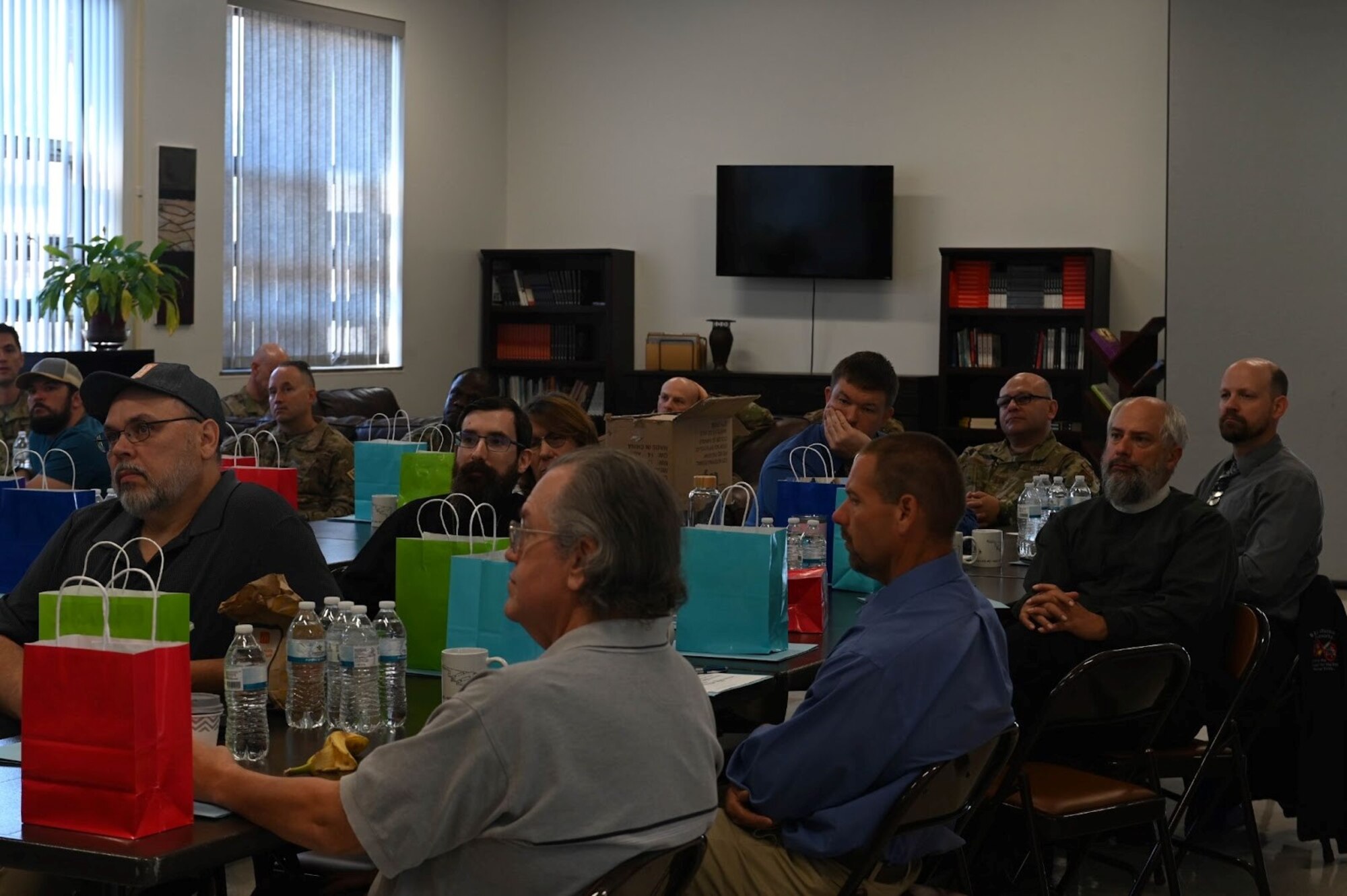 Civilians invited to the Spirit Chapel for discussions on the Extend the Bench program engage in conversation at Whiteman Air Force Base, Missouri, September 28, 2022. Those who are compatible with the program needs and commit to being on the Extend the Bench team will participate in training every three months. (U.S. Air Force photo by Airman 1st Class Hailey Farrell)