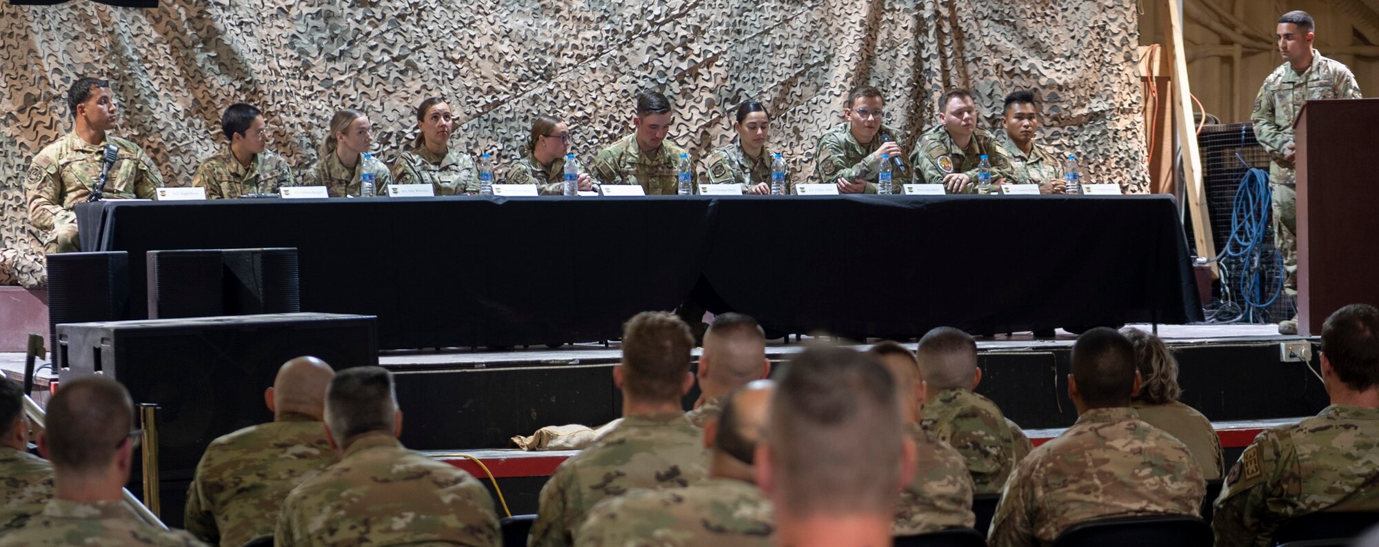 The 332d Air Expeditionary Wing 5/6 Council holds A Reverse Mentorship panel at an undisclosed location in Southwest Asia, September 30, 2022. The panel included ten up-and-coming Airmen answering leadership questions on how to improve relations between junior enlisted Airmen and senior enlisted leadership. (U.S. Air Force photo by Tech. Sgt. Jeffery Foster)