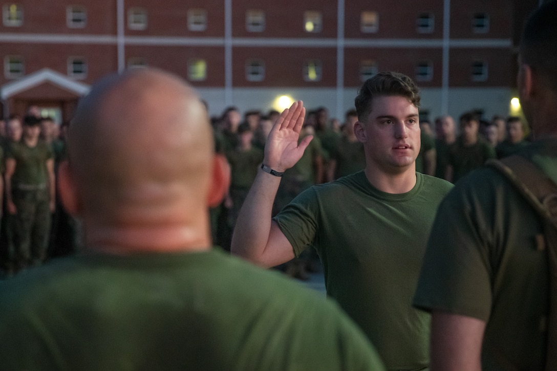 U.S. Marine Corps Lance Cpl. Jacob Shepard, a Brentwood, Tennessee, native and a rifleman with 2d Battalion, 8th Marine Regiment, 2d Marine Division, participates in his reenlistment ceremony on Camp Lejeune, North Carolina, Oct. 7, 2022. “Home is not home, this is home.” said Shepard when reflecting on his transition outside of the military. Shepard’s reenlistment demonstrates his fidelity and commitment to the United States Marine Corps. (U.S. Marine Corps photo by Cpl. Michael Virtue)