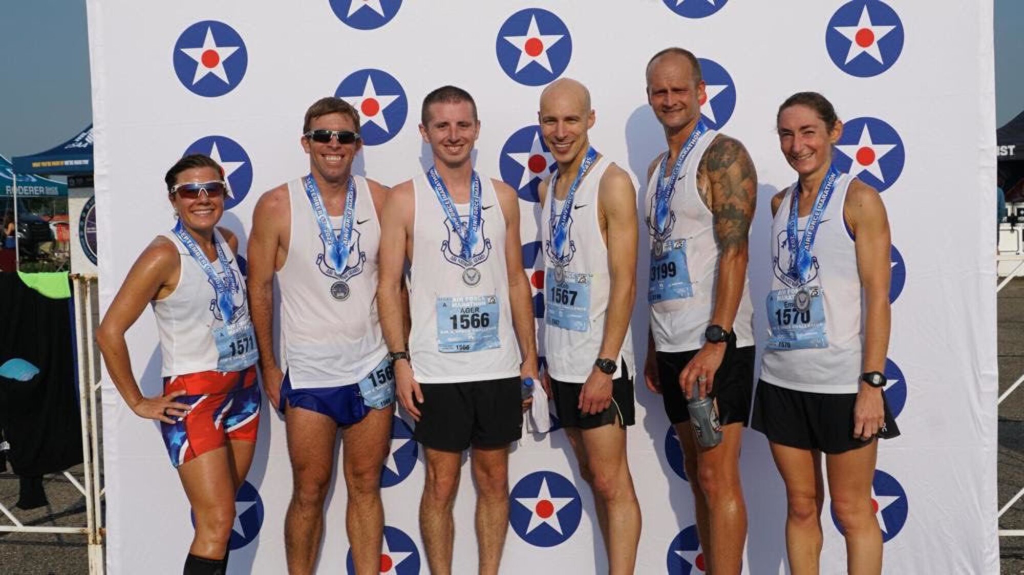 Team poses with medals