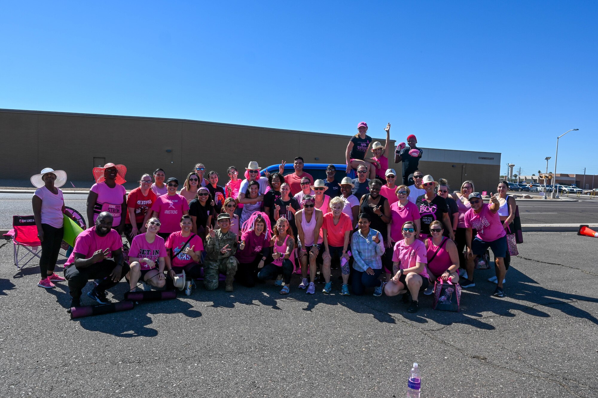 Members of the Luke Air Force Base community participate in a breast cancer awareness event Oct. 5, 2022, at Luke Air Force Base, Arizona.
