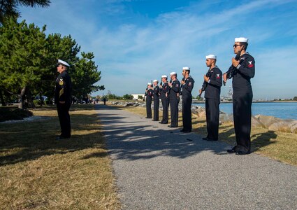 221012-N-CY569-0001 NORFOLK, Va. (Oct. 12, 2022) Sailors assigned to the Arleigh Burke-class, guided-missile destroyer USS Cole (DDG 67) stand ready to fire a 21-gun salute during a memorial ceremony commemorating the 22nd anniversary of the attack on Cole. Past and present Cole crew members gathered alongside families and guests for the ceremony at the USS Cole Memorial onboard Naval Station Norfolk. (U.S. Navy photo by Mass Communication Specialist 3rd Class Anthony Robledo)