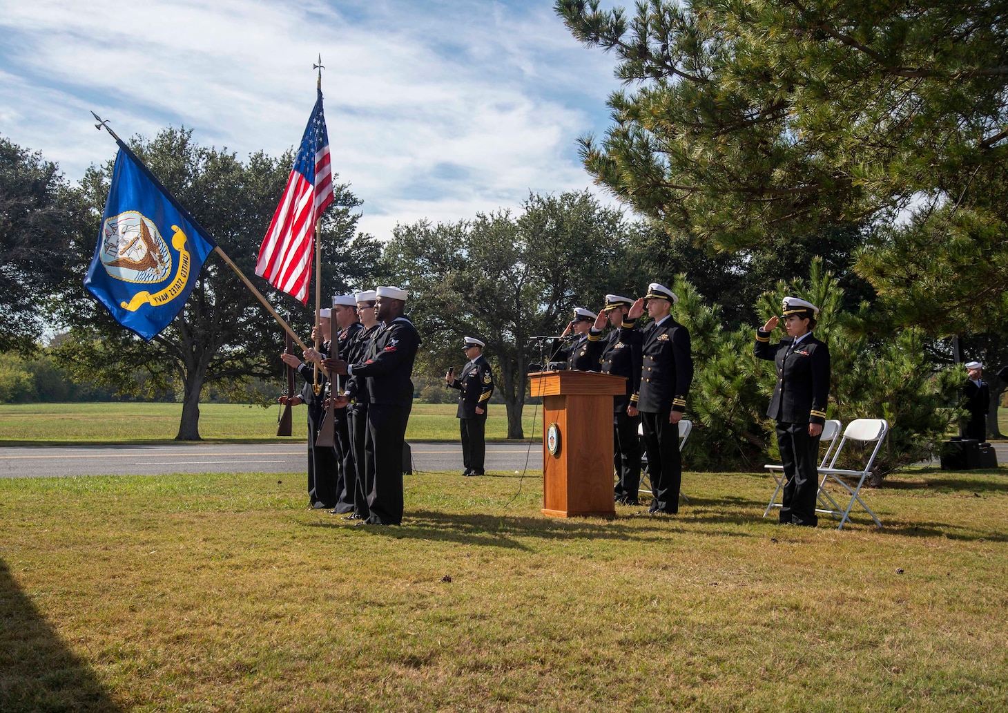 221012-N-CY569-0006 NORFOLK, Va. (Oct. 12, 2022) Sailors assigned to the Arleigh Burke-class, guided-missile destroyer USS Cole (DDG 67) parade the colors during a memorial ceremony commemorating the 22nd anniversary of the attack on Cole. Past and present Cole crew members gathered alongside families and guests for the ceremony at the USS Cole Memorial onboard Naval Station Norfolk. (U.S. Navy photo by Mass Communication Specialist 3rd Class Anthony Robledo)