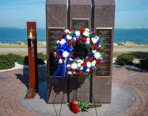 221012-N-CY569-0002 NORFOLK, Va. (Oct. 12, 2022) A wreath rests at the USS Cole Memorial following a ceremony commemorating the 22nd anniversary of the terrorist attack on the Arleigh Burke-class, guided-missile destroyer USS Cole (DDG 67). Past and present Cole crew members gathered alongside families and guests for the ceremony at the USS Cole Memorial onboard Naval Station Norfolk. (U.S. Navy photo by Mass Communication Specialist 3rd Class Anthony Robledo)