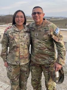 Virginia Army National Guard Command Sgt. Maj. Joseph R. Viera, right, the senior enlisted leader of 2nd Battalion, 224th Aviation Regiment, 29th Combat Aviation Brigade, 29th Infantry Division, and Staff Sgt. Kayla M. Jaeger, an intelligence analyst with the 116th Infantry Brigade Combat Team, 29th ID, pose for a photo while deployed to Camp Bondsteel, Kosovo, March 18, 2022. Viera and Jaeger deployed to Kosovo in January 2022 for a nine-month rotation in support of Operation Joint Guardian.