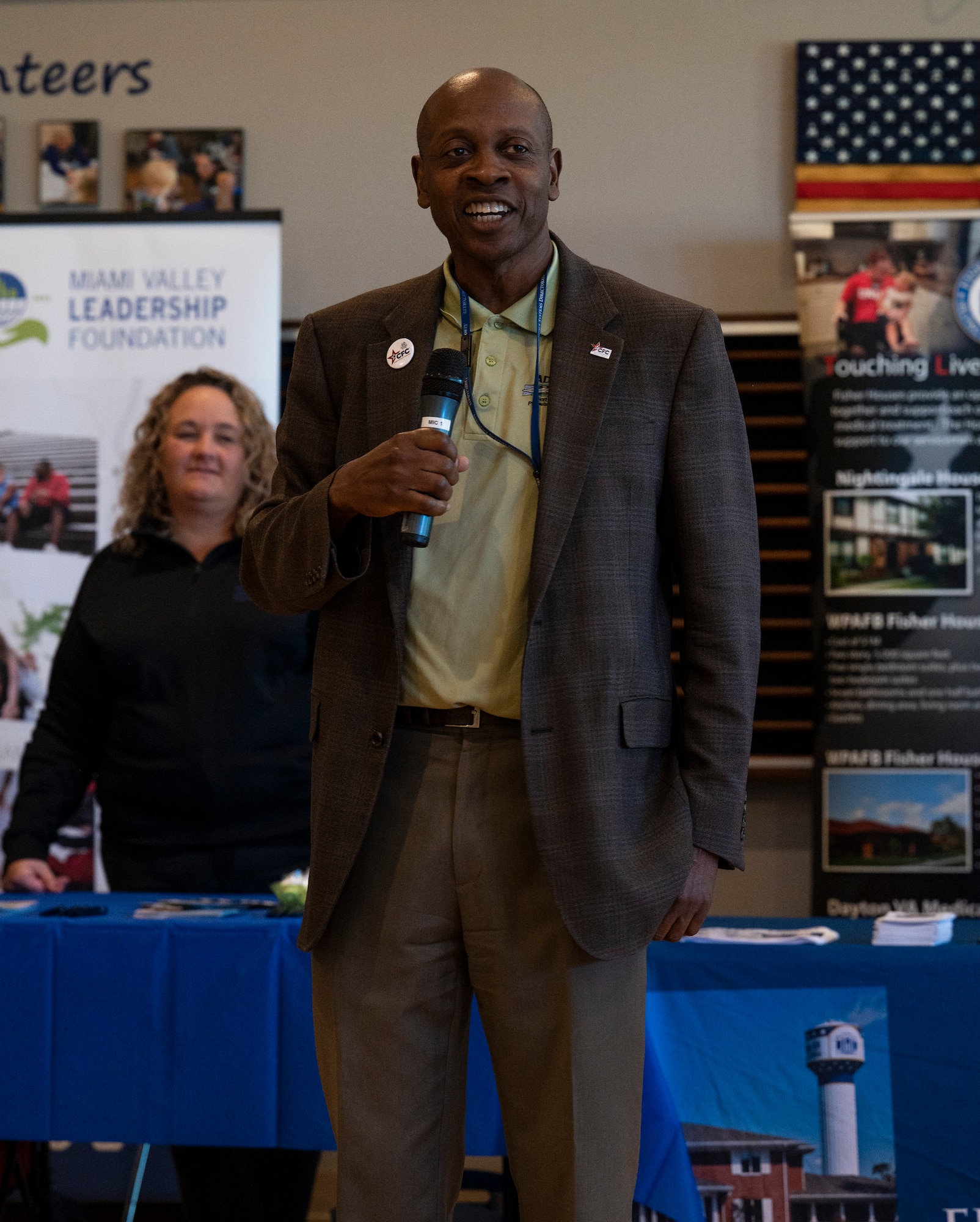 A man speaks to the crowd.