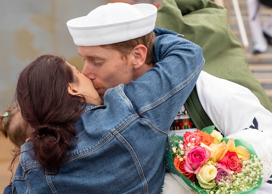 Sailors assigned to the Whidbey Island-class dock landing ship USS Gunston Hall (LSD 44) reunite with their families on the pier after the ship returned to Joint Expeditionary Base Little Creek-Fort Story following a deployment with the Kearsarge Amphibious Ready Group (ARG), Oct. 13.