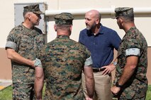 U.S. Marine Corps Maj. Gen. Eric Austin, left, commanding general, 1st Marine Aircraft Wing, speaks to Marine Corps Base Hawaii leadership during a visit to MCBH, Sept. 27, 2022. The purpose of the visit was to inform Austin on the base’s progression toward Force Design 2030. (U.S. Marine Corps photo by Lance Cpl. Isaiah Hill)