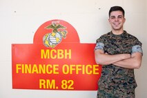 U.S. Marine Corps Sgt. Andrew Harrah, financial technician, Headquarters Battalion, Marine Corps Base Hawaii, poses for a photo, MCBH, Oct. 5, 2022. Harrah was able to rely on his Hispanic upbringing to overcome adversity during an unexpected career change from reconnaissance to financial technician. (U.S. Marine Corps photo by Cpl. Samantha Sanchez)
