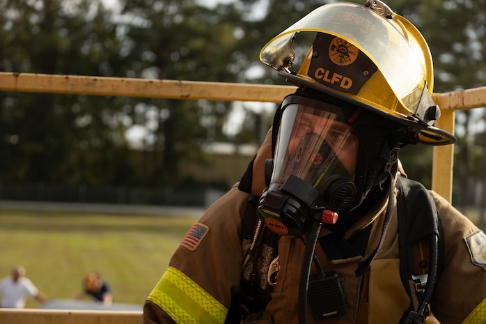 Caleb Mitchell, a firefighter with Camp Lejeune Fire and Emergency Services Division (FESD), participates in a live training exercise held at the FESD training center on Marine Corps Base (MCB) Camp Lejeune, North Carolina, Sept. 27, 2022. The MCB Camp Lejeune FESD participated in various fire-safety activities during the month of October to promote National Fire Prevention Week 2022.This year’s theme is “fire won’t wait, plan your escape.” (U.S. Marine Corps photo Lance Cpl. Antonino Mazzamuto)