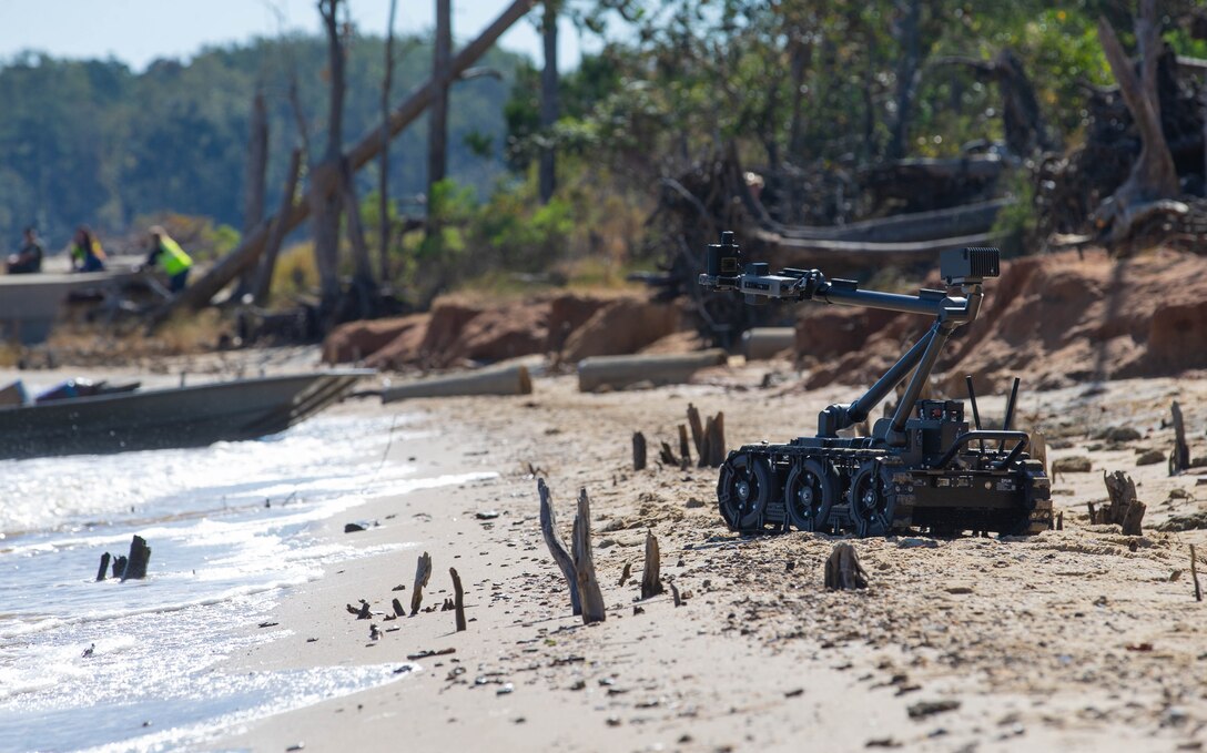 A Man Transportable Robot System, a robot operated by explosive ordnance disposal technicians to remotely diffuse ordnance, moves towards a boat during the Sudden Crisis 2022 training exercise at Marines Corps Air Station Cherry Point, North Carolina, Oct. 11, 2022. The training event exercised command and control, reporting, interoperability with external organizations, and validated tactics, techniques and procedures, in the event the air station needs to elevate its force protection condition. (U.S. Marine Corps photo by Lance Cpl. Jade Farrington)