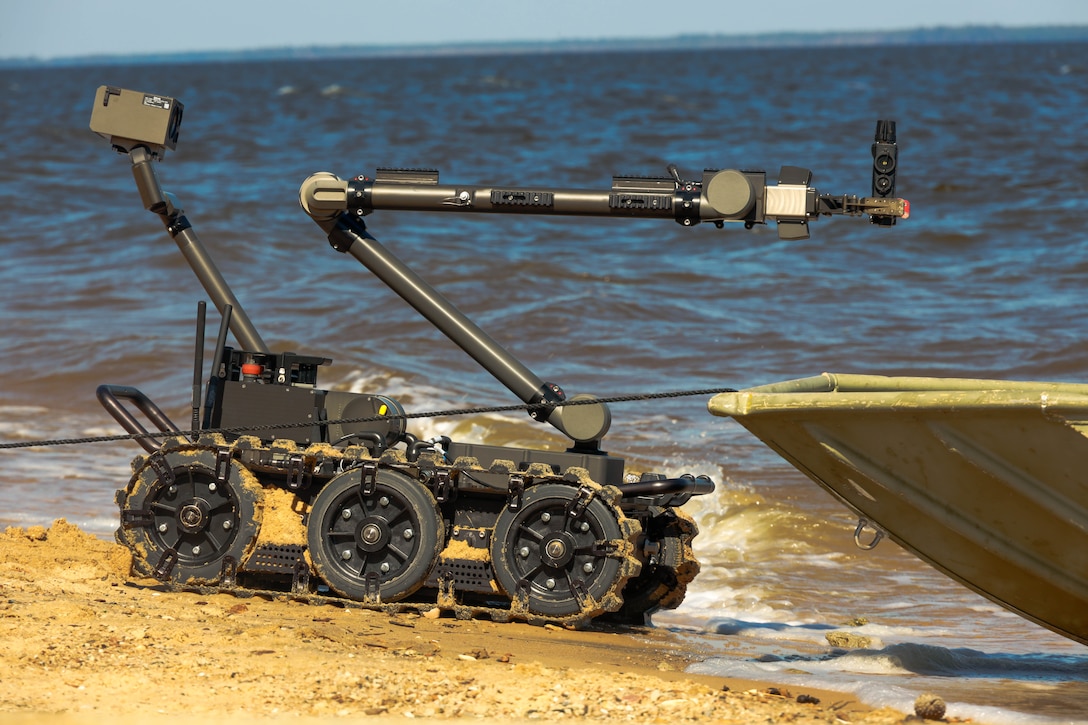 A Man Transportable Robot System, a robot used by explosive ordnance disposal technicians to remotely diffuse ordnance, makes assessments during the Sudden Crisis 2022 training exercise at Marine Corps Air Station Cherry Point, North Carolina, Oct. 11, 2022. The training event exercised command and control, reporting, interoperability with external organizations, and validated tactics, techniques and procedures, in the event the air station needs to elevate its force protection condition. (U.S. Marine Corps photo by Lance Cpl. Tristen Reed)