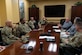 Senior enlisted leaders and Army and Air Force Exchange Service representatives talk during a meeting.