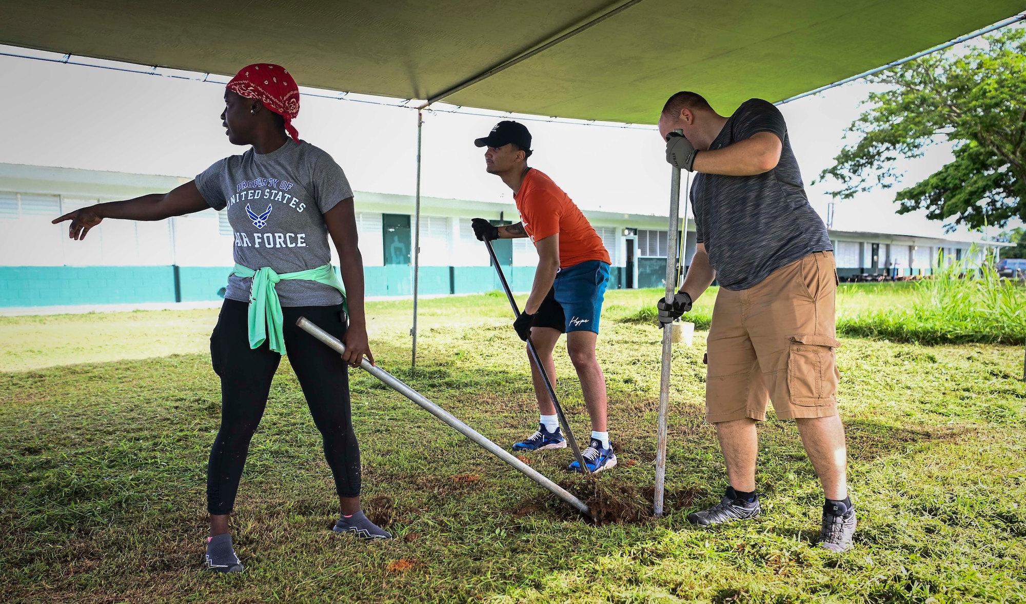 Airmen from the 36th Logistics Readiness Squadron and the 36th Maintenance Squadron, partners with the Guam Urban Community Forestry Program to help plant trees at P.C. Lujan Elementary School in support of Guam Arbor Day in Barrigada, Guam, Oct. 10, 2022.