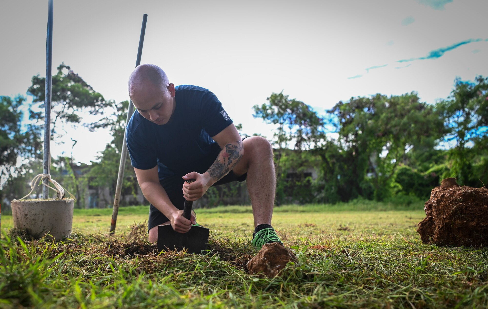 Airmen from the 36th Logistics Readiness Squadron and the 36th Maintenance Squadron, partners with the Guam Urban Community Forestry Program to help plant trees at P.C. Lujan Elementary School in support of Guam Arbor Day in Barrigada, Guam, Oct. 10, 2022.