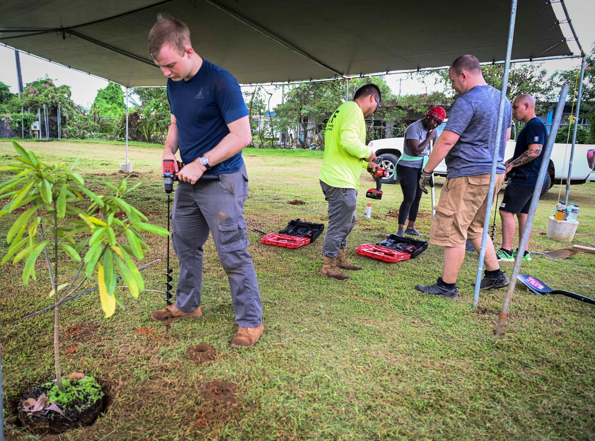 Airmen from the 36th Logistics Readiness Squadron and the 36th Maintenance Squadron, partners with the Guam Urban Community Forestry Program to help plant trees at P.C. Lujan Elementary School in support of Guam Arbor Day in Barrigada, Guam, Oct. 10, 2022.