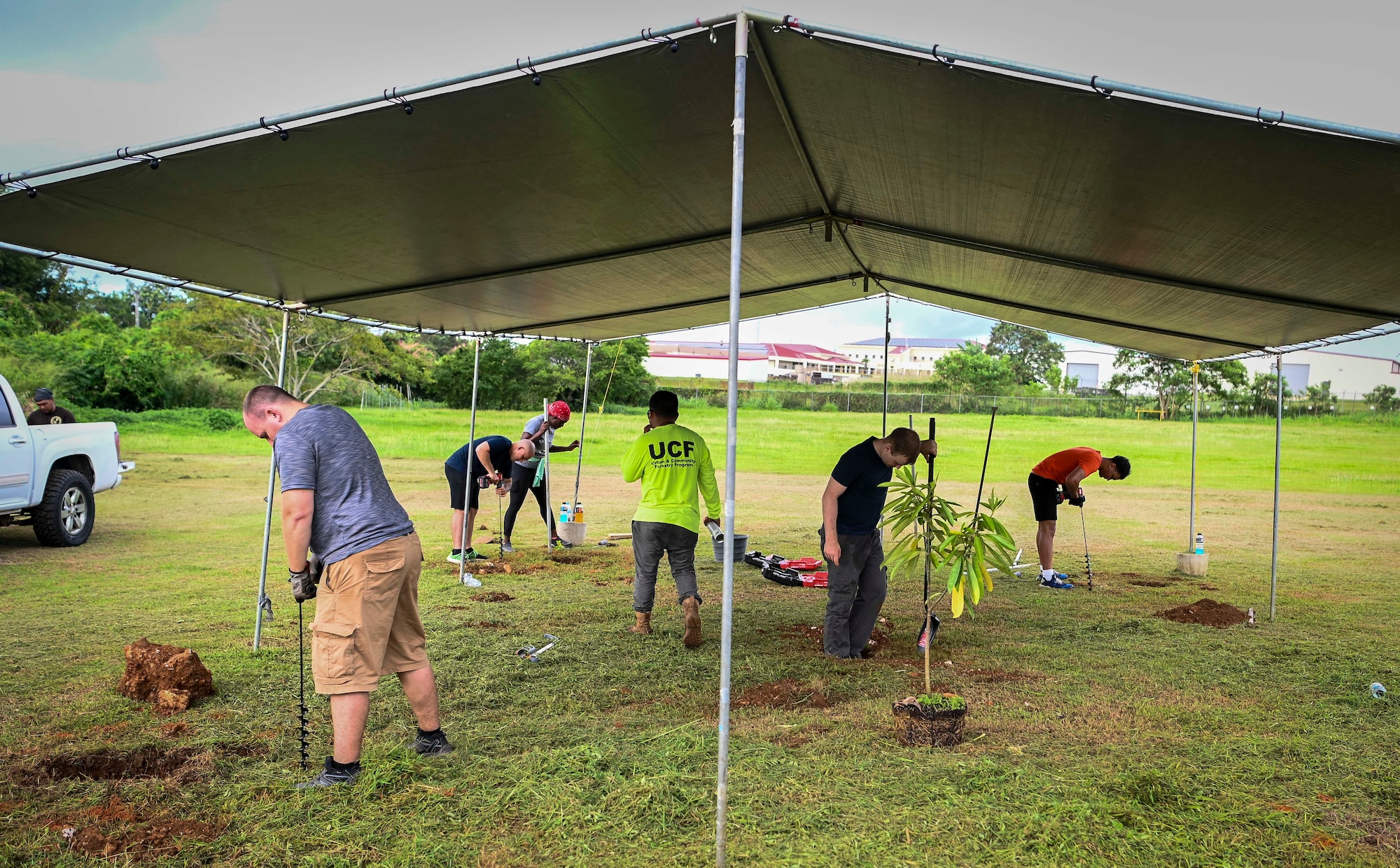 Airmen from the 36th Logistics Readiness Squadron and the 36th Maintenance Squadron, partners with the Guam Urban Community Forestry Program to help plant trees at P.C. Lujan Elementary School in support of Guam Arbor Day in Barrigada, Guam, Oct. 10, 2022.