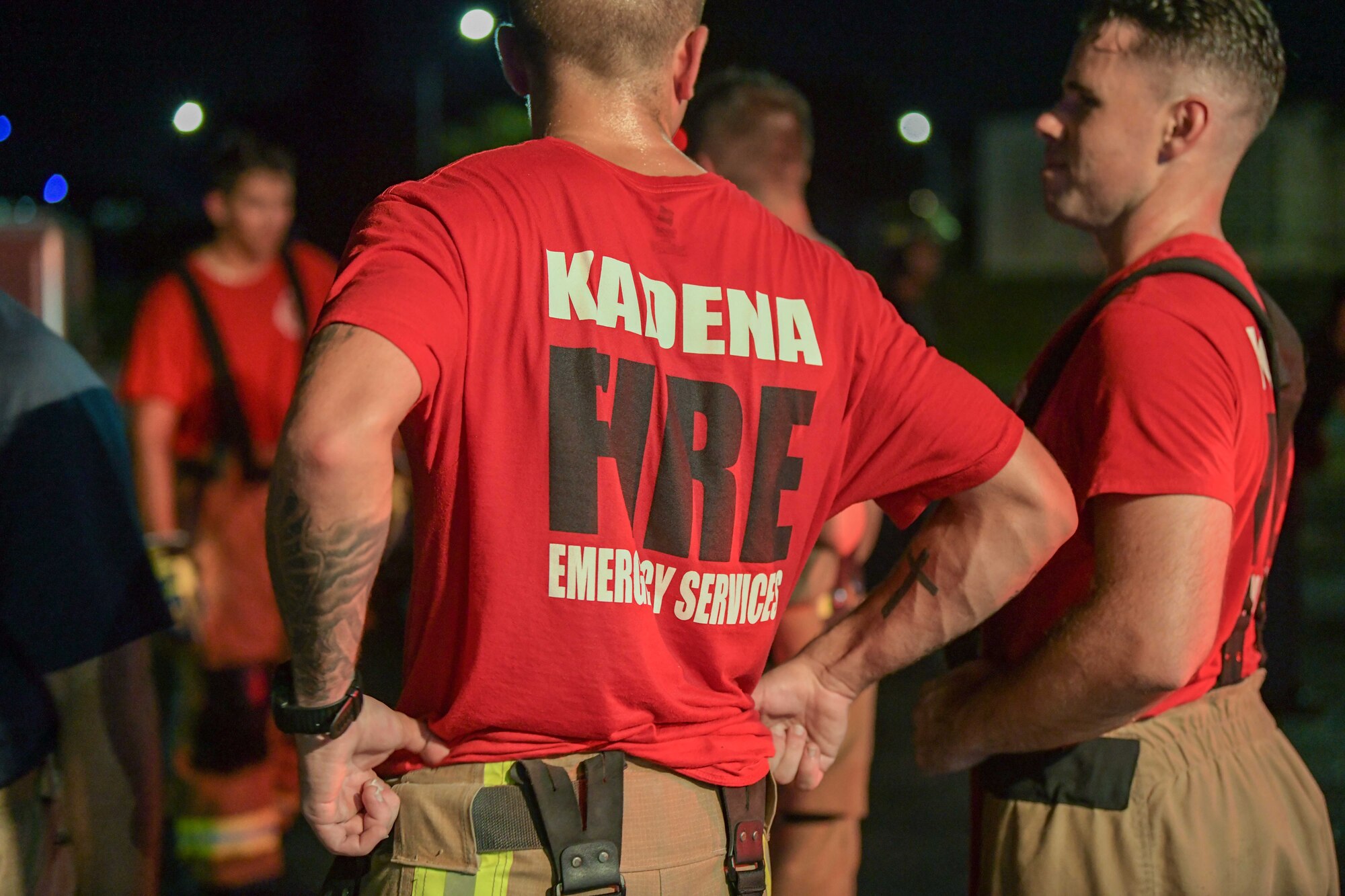 Firefighter shows his t-shirt logo.