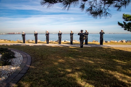 221012-N-CY569-0004 NORFOLK, Va. (Oct. 12, 2022) Sailors assigned to the Arleigh Burke-class, guided-missile destroyer USS Cole (DDG 67) stand ready to fire a 21-gun salute during a memorial ceremony commemorating the 22nd anniversary of the attack on Cole. Past and present Cole crew members gathered alongside families and guests for the ceremony at the USS Cole Memorial onboard Naval Station Norfolk. (U.S. Navy photo by Mass Communication Specialist 3rd Class Anthony Robledo)