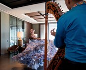Woman twirls her dress during a performance
