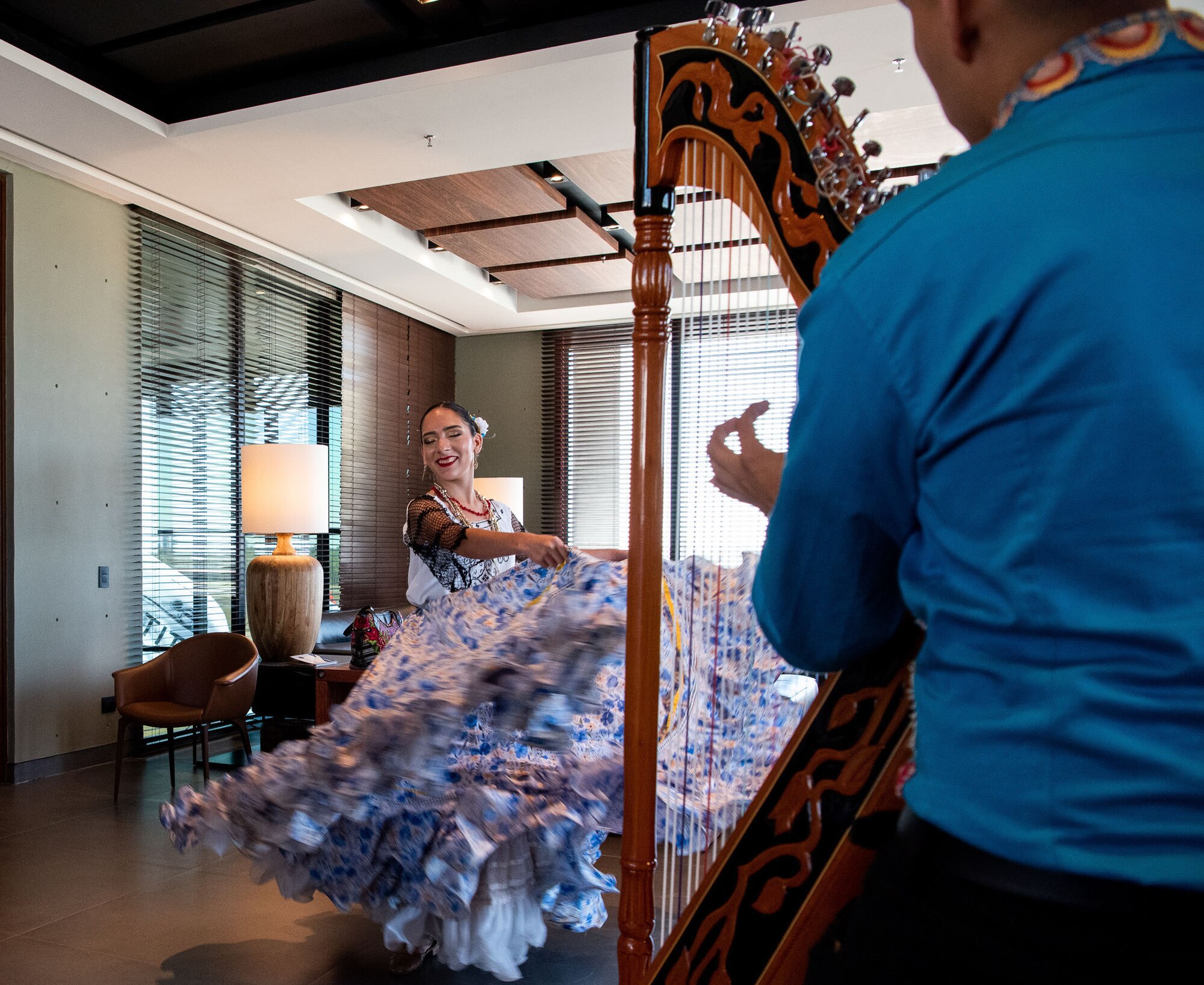 Woman twirls her dress during a performance