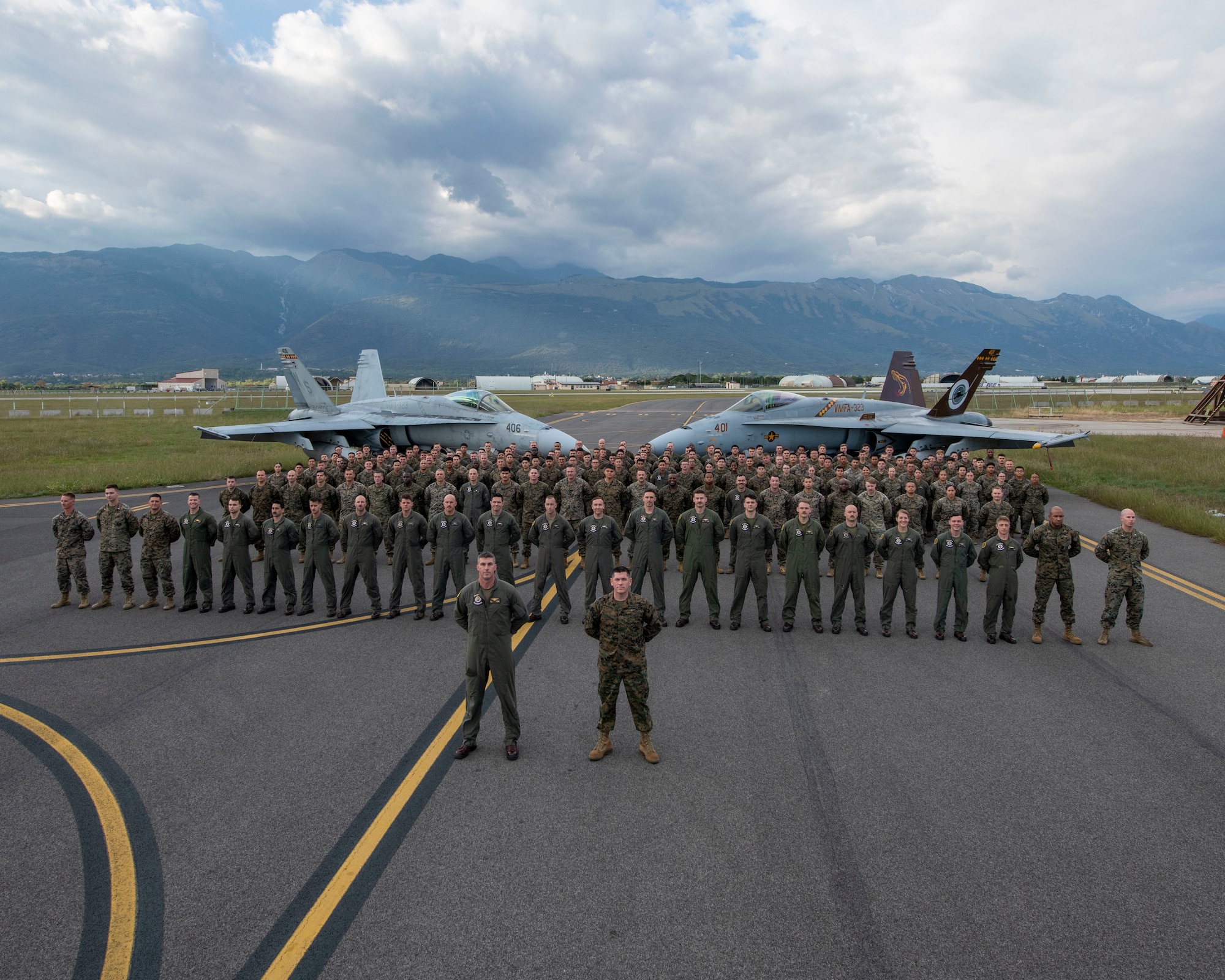 United States Marines assigned to the Marine Fighter Attack Squadron 323 out of Marine Corps Air Station Miramar, California, pose for a photo at Aviano Air Base, Italy, Sept. 22, 2022. More than 200 U.S. Marines were deployed to Aviano Air Base, Italy, for approximately two months to integrate and train with the 510th Fighter Squadron as part of a dynamic force employment. (U.S. Air Force photo by Senior Airman Brooke Moeder)