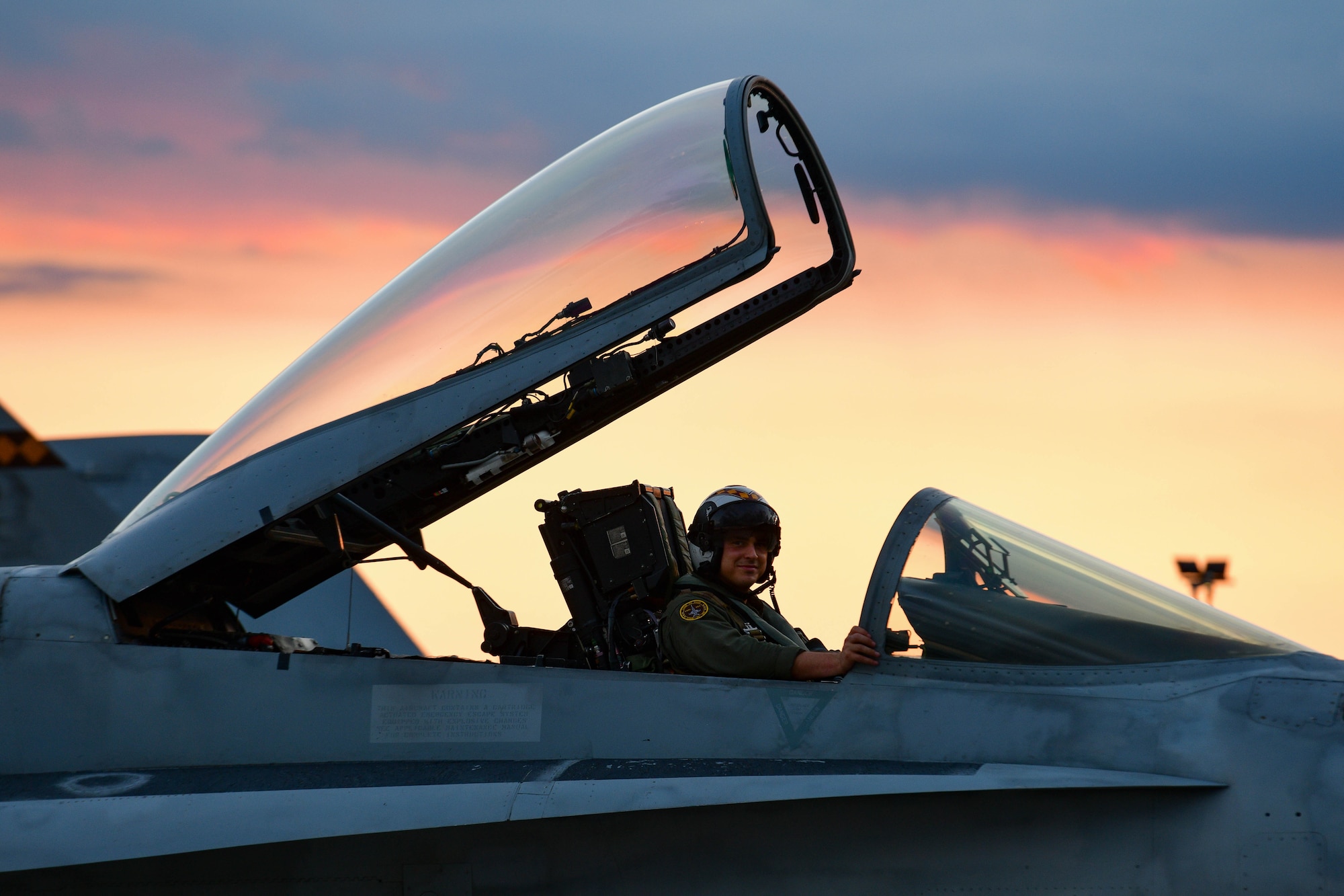 A United States Marine F/A-18 Hornet pilot assigned to the Marine Fighter Attack Squadron 323 out of Marine Corps Air Station Miramar, California, prepares to fly at Aviano Air Base, Italy, Sept. 20, 2022. During the training sorties, the VMFA-323 Squadron fought as an element alongside the 510th Fighter Squadron, meaning two F-16s or two F-18s worked together to defeat a simulated threat as quickly as possible. (U.S. Air Force photo by Senior Airman Brooke Moeder)