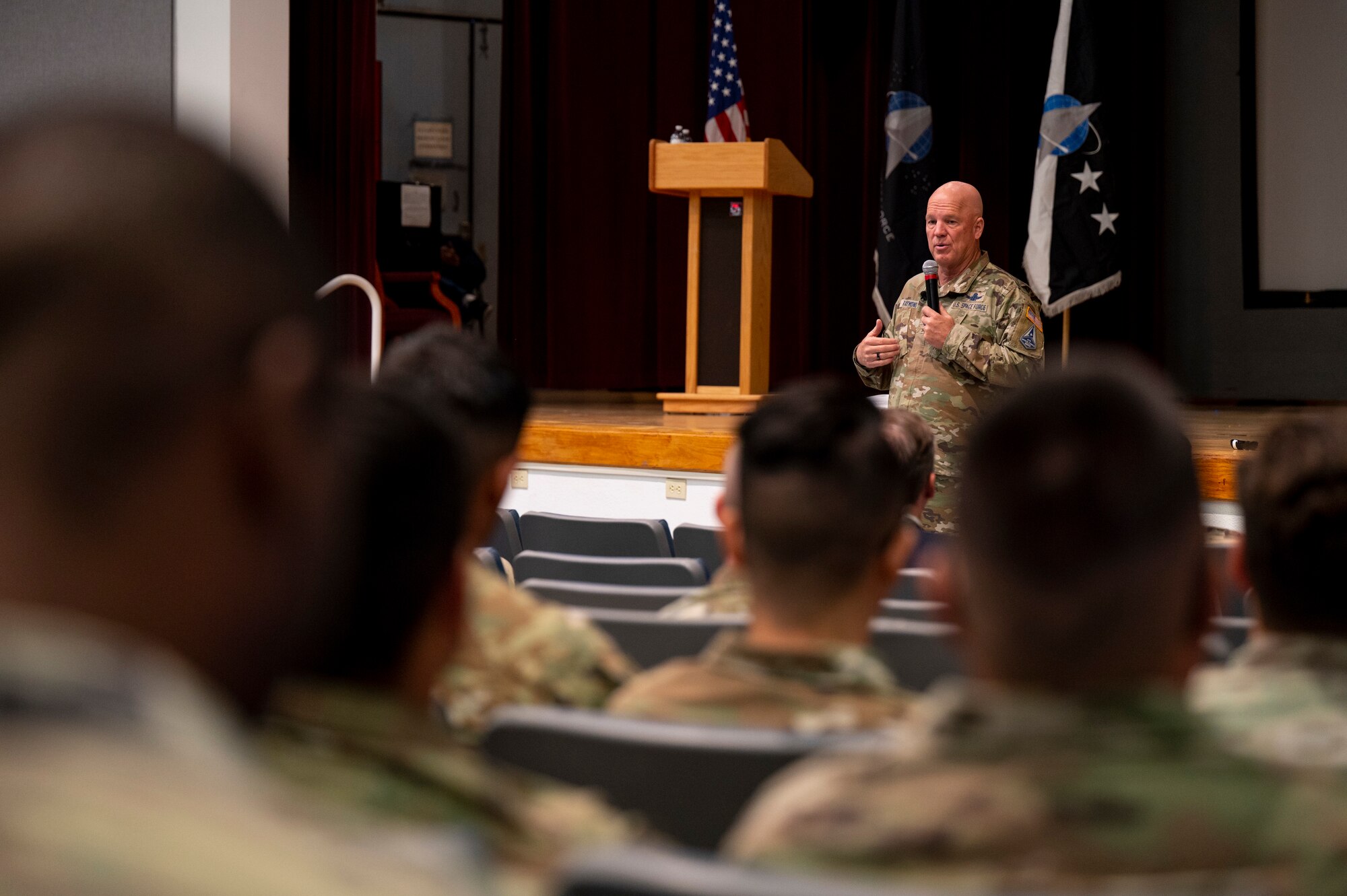 General talks to crowd.