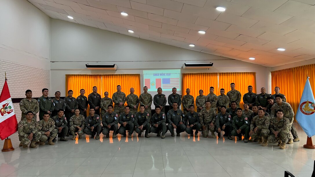 U.S Air Force’s 571st Mobility Support Advisory Squadron (MSAS) advisors gather for a photo with Fuerza Aérea de Peru (FAP)’s Grupo Aereo N. 42 service members, Sept. 7, 2022, in Base Area Coronel Francisco Secada Vignetta Air Base, Peru. During the 20-day training engagement, MSAS air advisors trained FAP service members, officer and enlisted, on aerial port operations, cargo load planning, supply and aircraft maintenance through classroom instruction, hands-on training and multiple exercises in order to improve the FAP’s capabilities for real-world situations and global exercises. (U.S. Air Force photo by Tech. Sgt. Anthony Garcia)