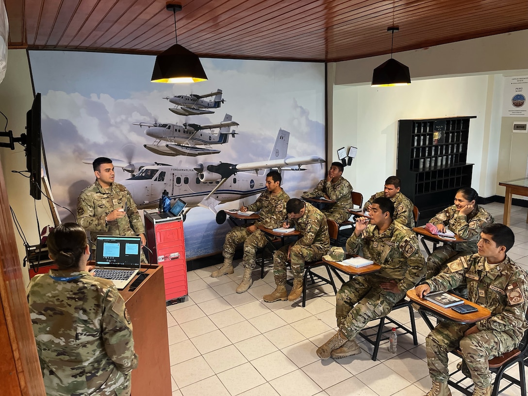 U.S. Air Force Staff Sgt. Sukhpreet Chinna, top left, a 571st Mobility Support Advisory Squadron advisor, instructs military service members of the Fuerza Aérea de Peru, Aug. 26, 2022, in Base Area Coronel Francisco Secada Vignetta Air Base, Peru. The purpose of the training was to build partner capacity between the United States Air Force and the Peruvian Air Force equivalent, known as Fuerza Aérea de Peru (FAP). (U.S. Air Force photo by Tech. Sgt. Anthony Garcia)