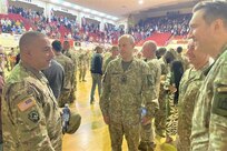 Maj. Gen. Mark McCormack, left, commanding general of the 28th Infantry Division, talks with Brig. Gen. Arturas Radvilas, Lithuanian Land Forces commander, Command Sgt. Maj. Darius Masiulis, Lithuanian Land Forces command sergeant major, and Brig. Gen. Modestas Petrauskas, Lithuanian defense attaché to the United States and Canada, at the 28th ID departure ceremony in Harrisburg, Pa., on Oct. 9, 2022.