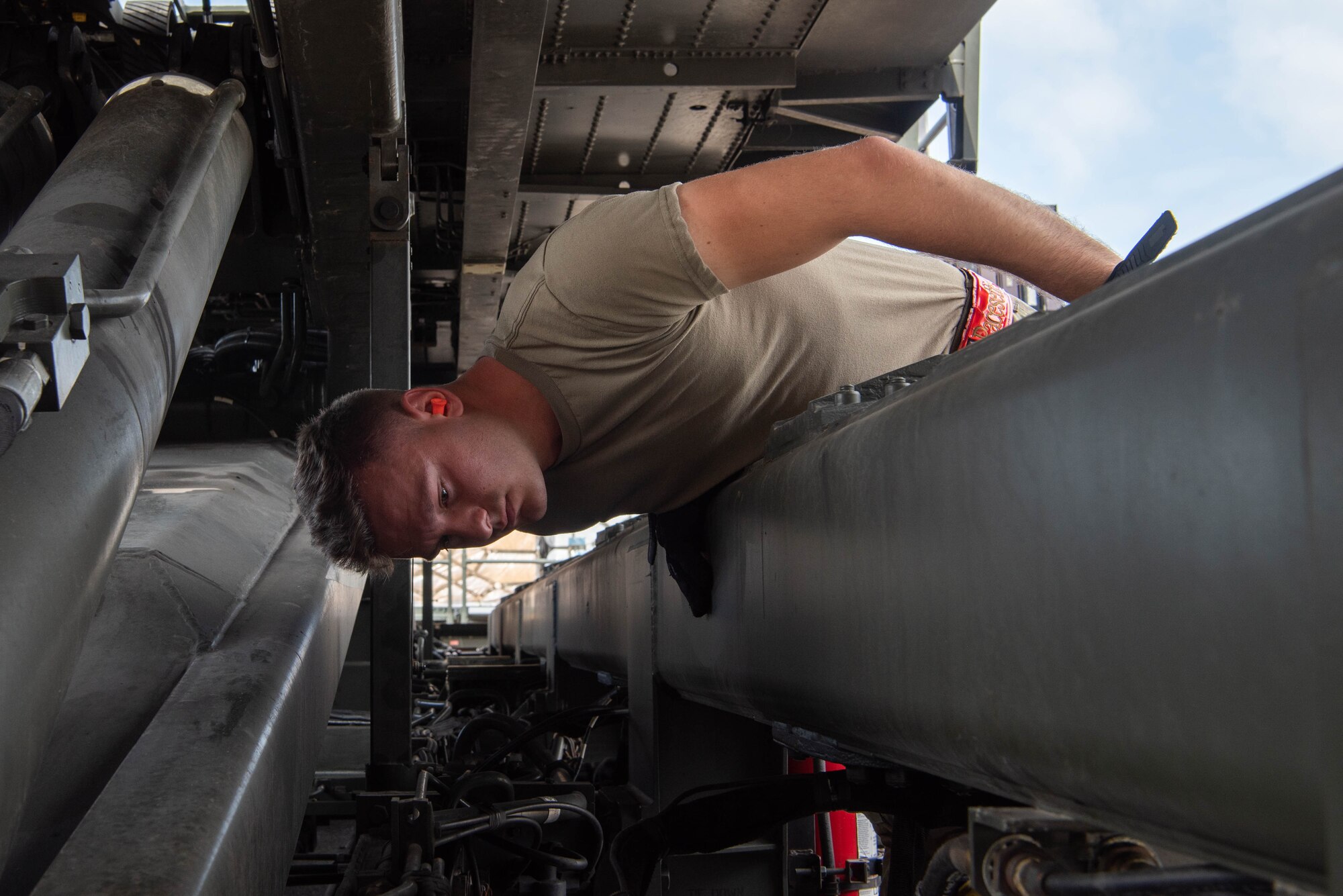 An Airman inspects a cargo load vehicle.